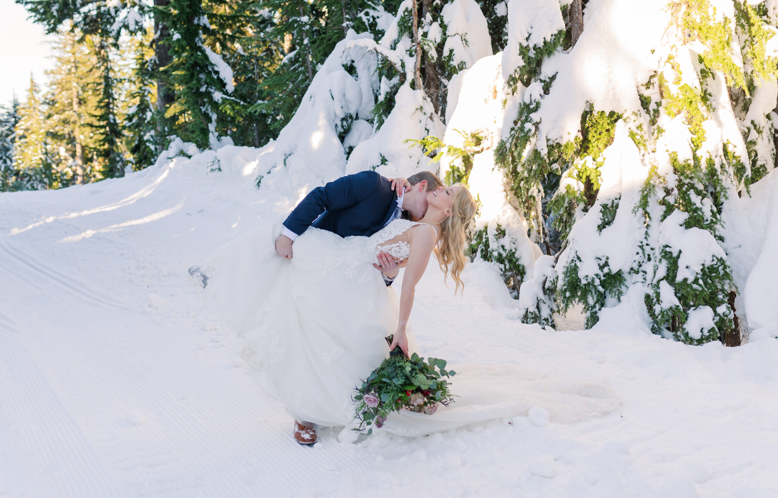 Bride-and-groom-dip-down-for-romantic-kiss