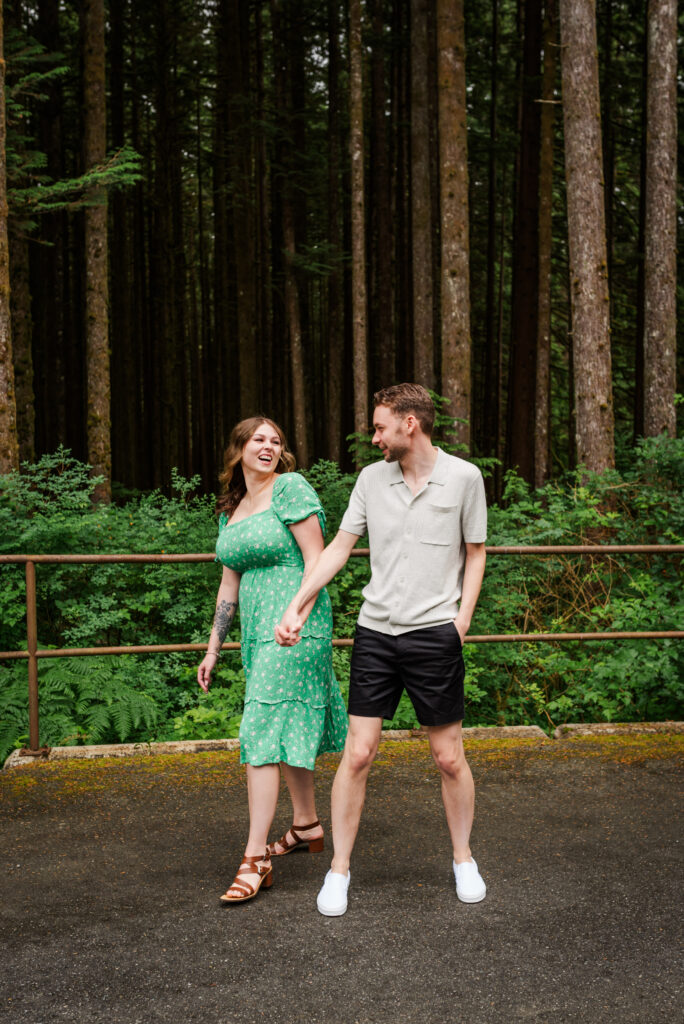 Couple  laughing and smiling at each other at their engagement session in Maple Ridge.