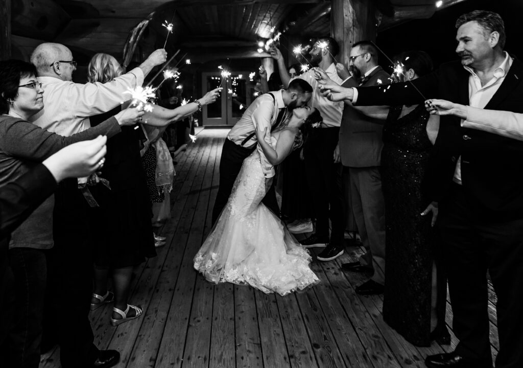 Sparkler exit bride and groom kiss.