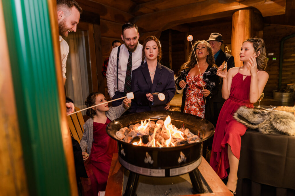 S'mores to end the wedding day, some guests around a propane fire.