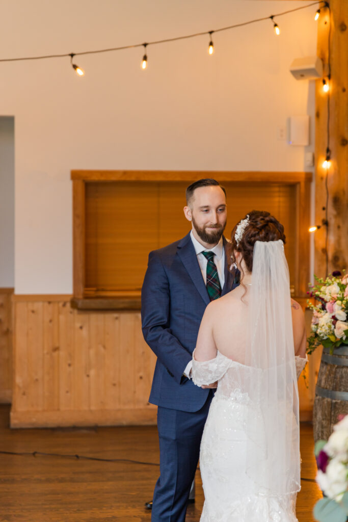 Groom looking at his bride during the wedding ceremony.