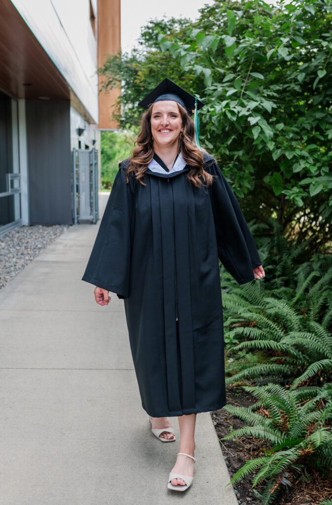 Grad student smiling and feeling happy on the day of her graduation. 