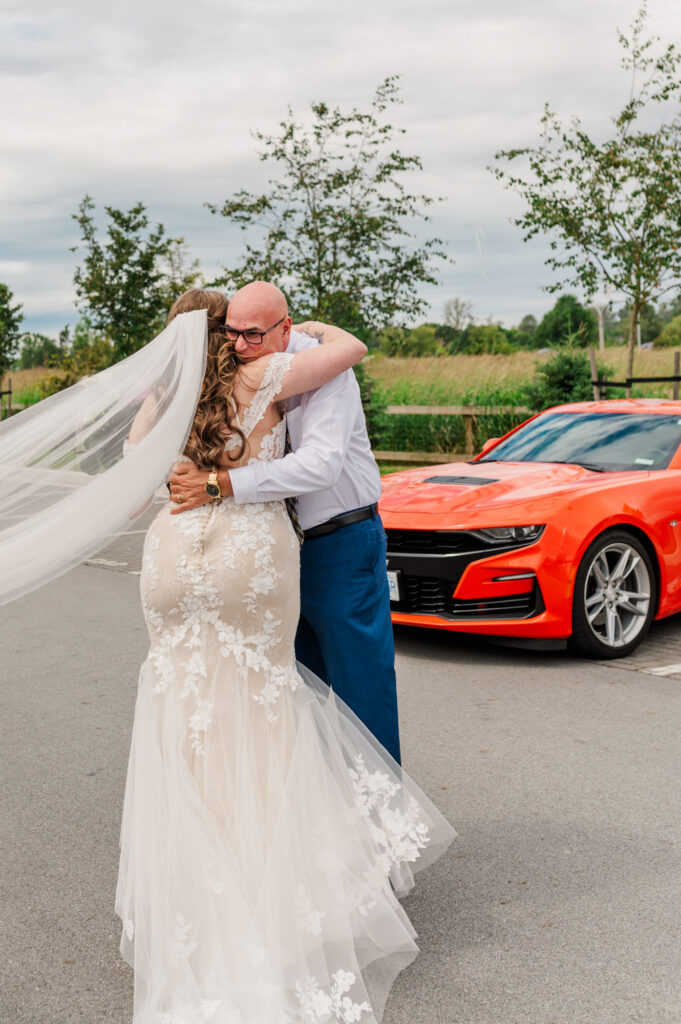 Dad's first look of his daughter sports car in the backround