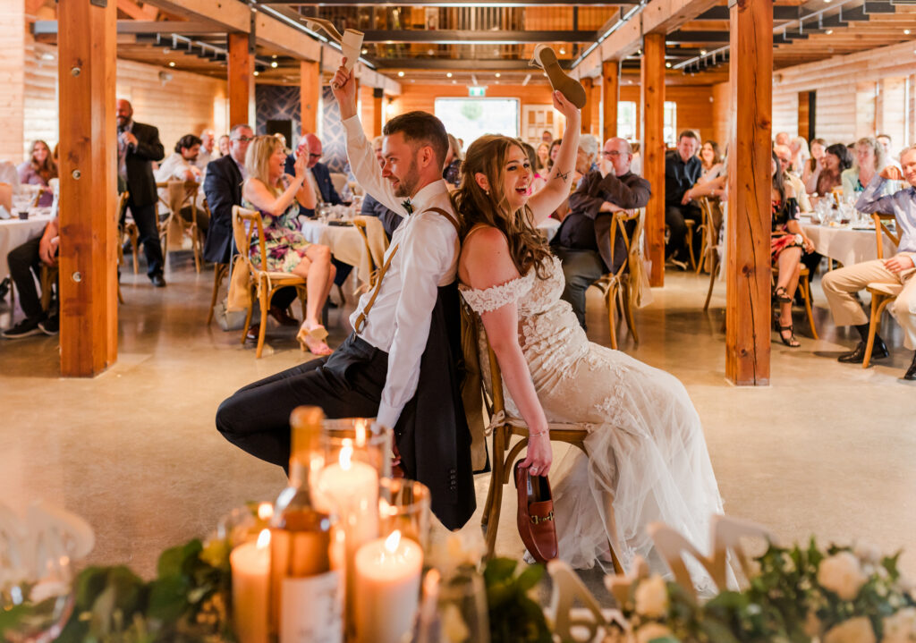 Bride and groom had a shoe game at their wedding with guests watching.