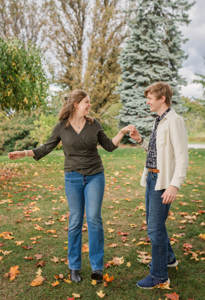 Just Engaged and couple dancing together at Queen Elizabeth Park, Vancouver BC.
